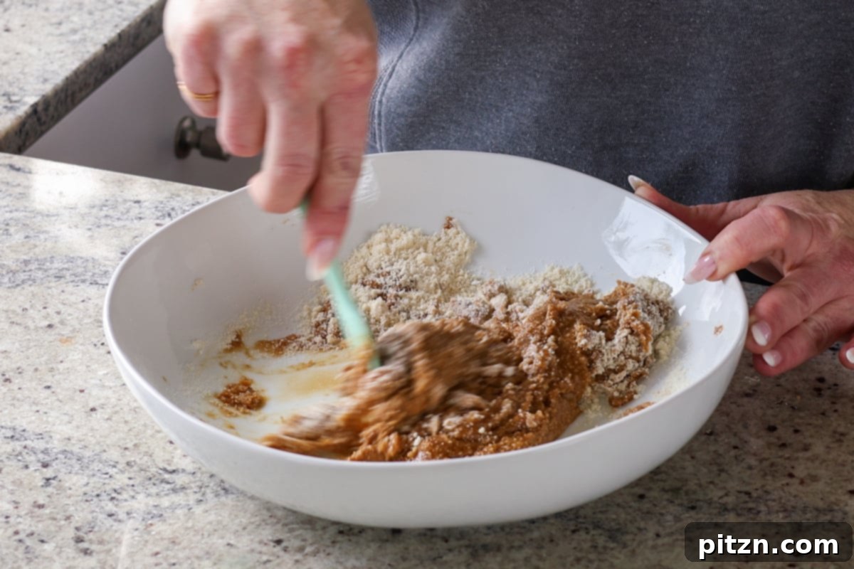 Allergy Friendly Gochujang Caramel Cookies 11 mixing the wet ingredients into the dry to form the cookie dough