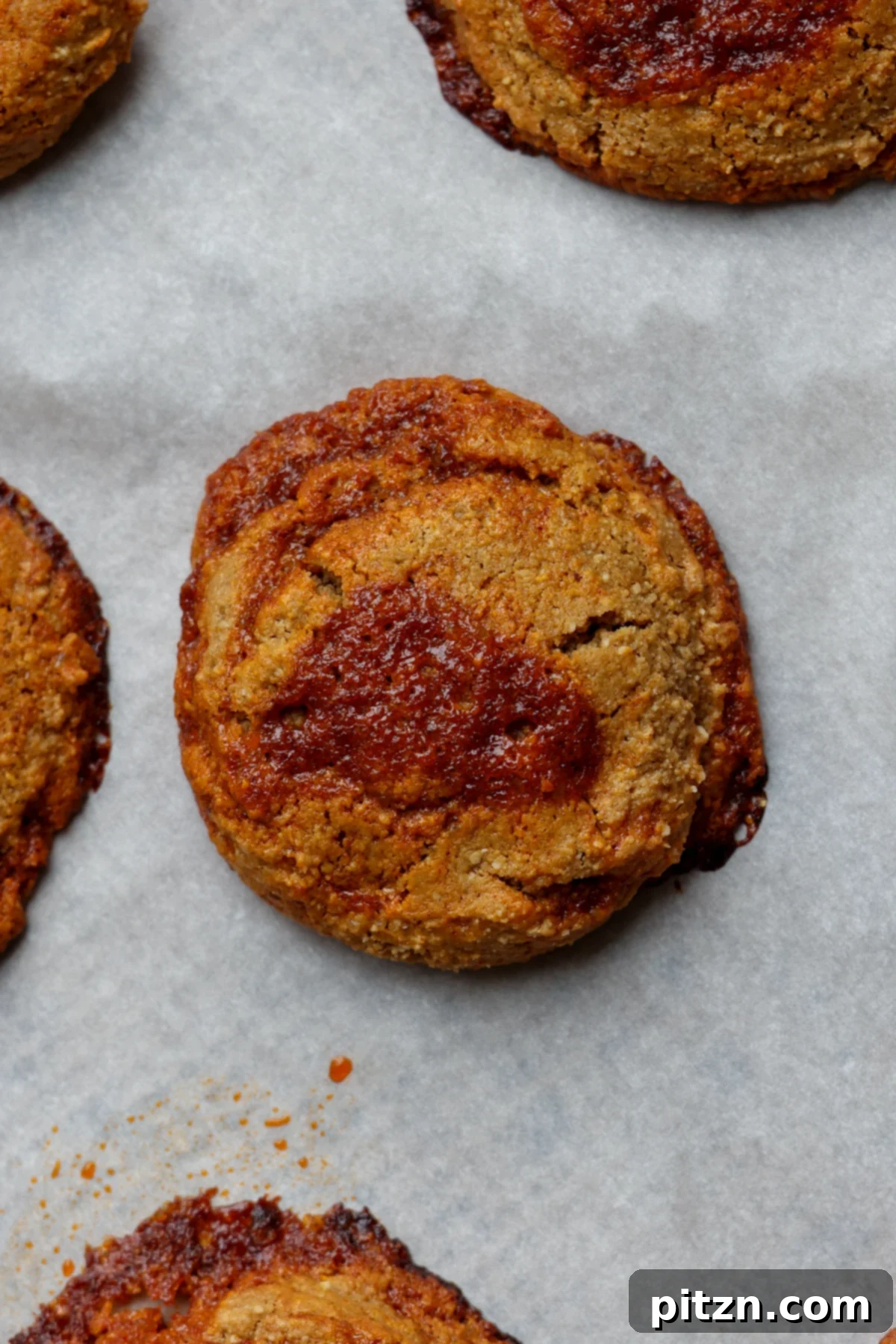 Allergy Friendly Gochujang Caramel Cookies 3 close-up of gochujang caramel cookies artfully arranged on a parchment-lined baking sheet