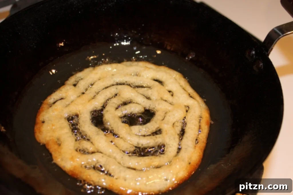 Preparation stages of Vegan Jalebi, an Indian Sweet shaped like pretzels, deep-fried and dipped in sugar syrup. Like a funnel cake.