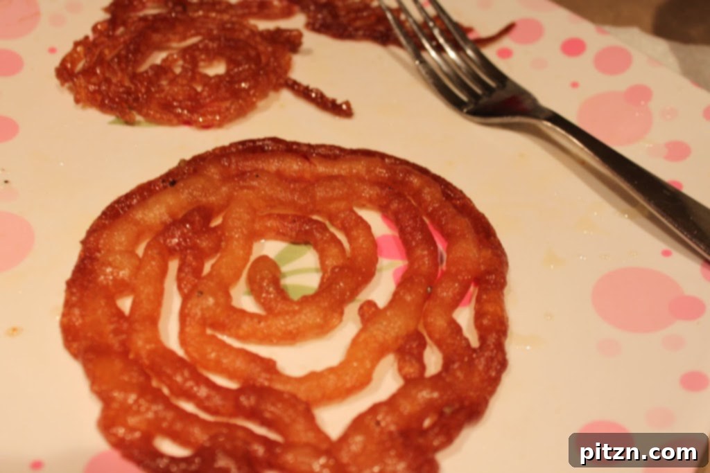 Comparison of Vegan Jalebi shapes and crispiness based on piping hole size.