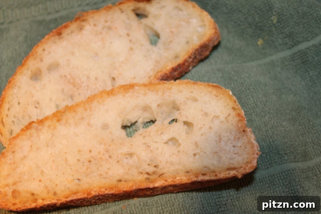 Effortless Homemade Bread 4 Sliced no-knead bread revealing its airy, open crumb structure.
