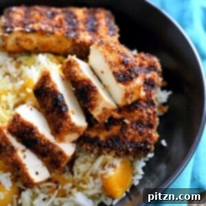 Spicy Crispy Breaded Tofu Strips, marinated and perfectly breaded, suitable for grilling or baking, served on a platter. Vegan, gluten-free option.