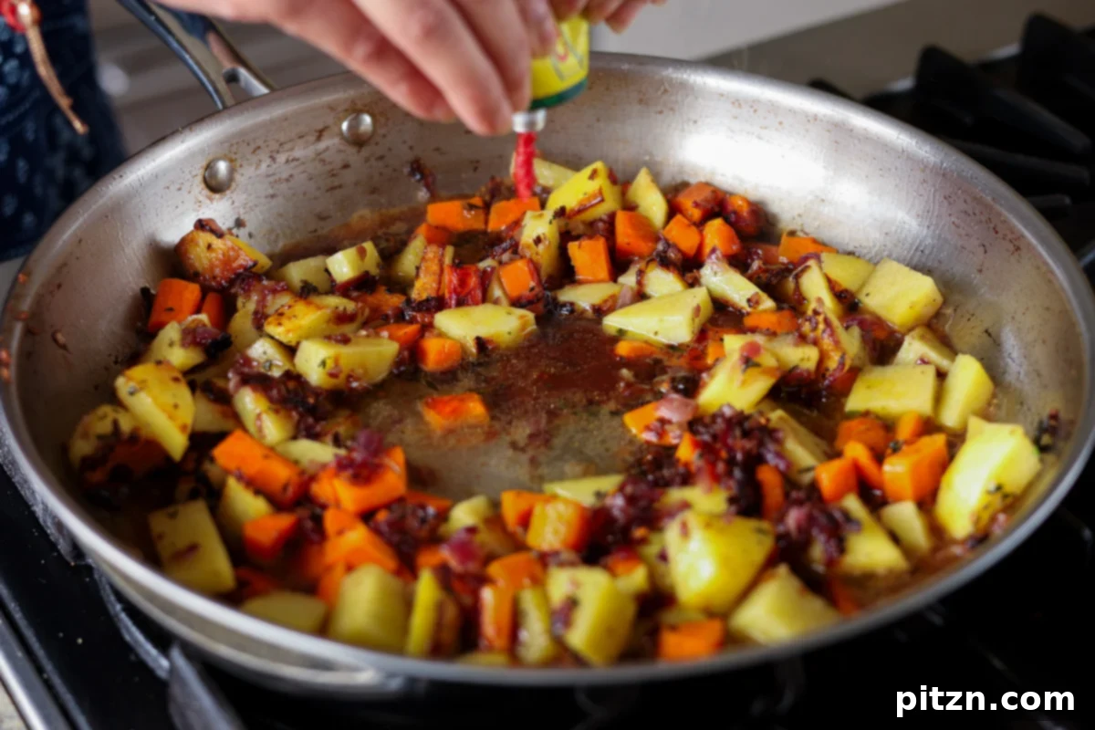 One Pan Chicken Style Braised Tofu and Vegetables 17 Adding a splash of liquid, possibly stock or sauce, into the pan amidst the vegetables and tofu to create the braising liquid.