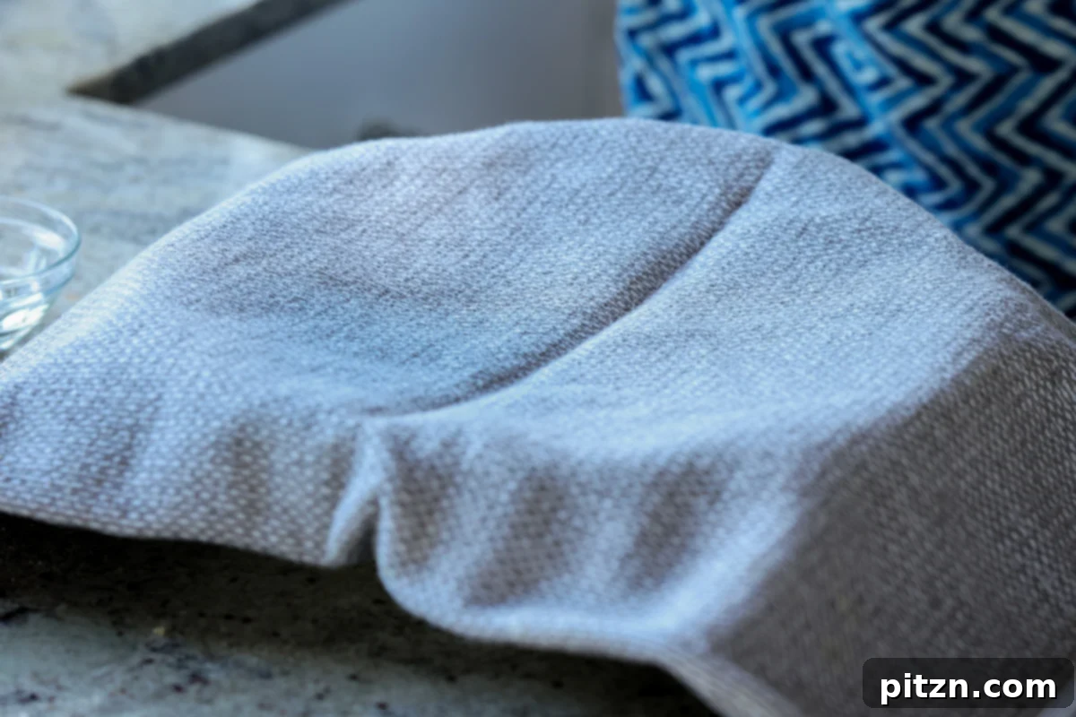 Yeast-Free Spinach Paratha Flatbread 16 A bowl of dough resting, covered with a kitchen towel, allowing it to soften and rehydrate.