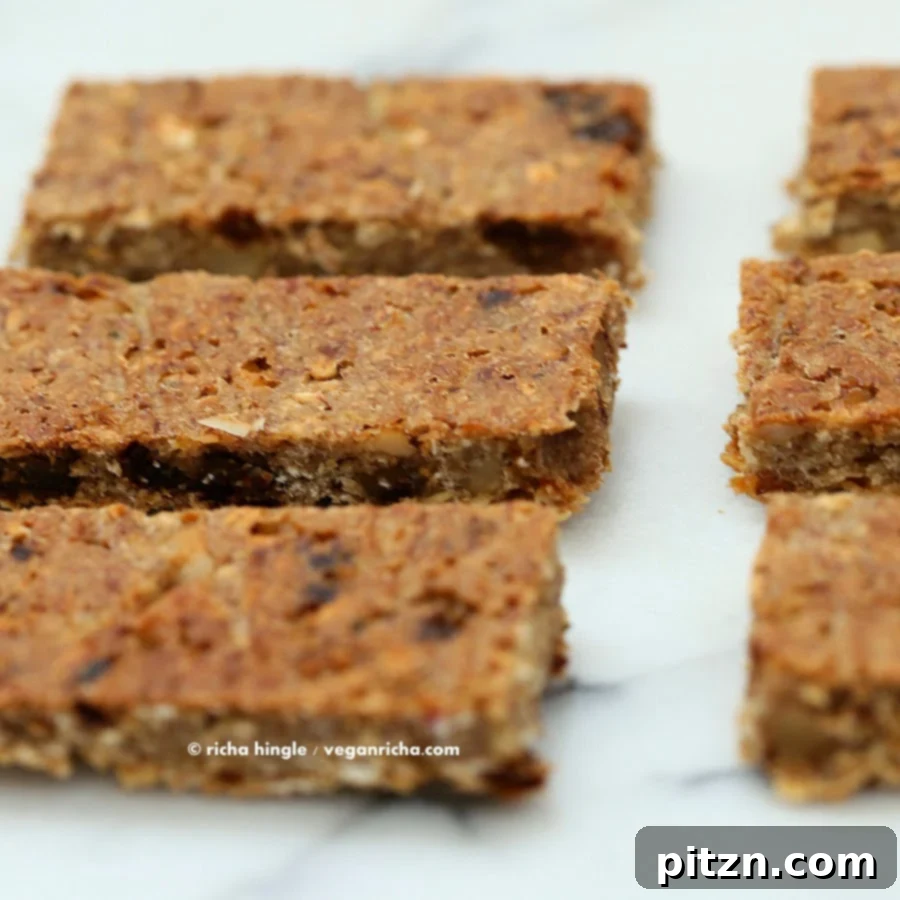 Close-up of baked banana nut snack bars arranged artfully on a marble countertop, ready to be enjoyed.