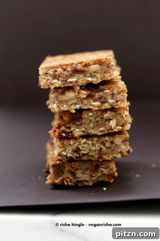 A stack of golden-brown banana nut snack bars, highlighting their inviting texture and ready-to-eat appeal.
