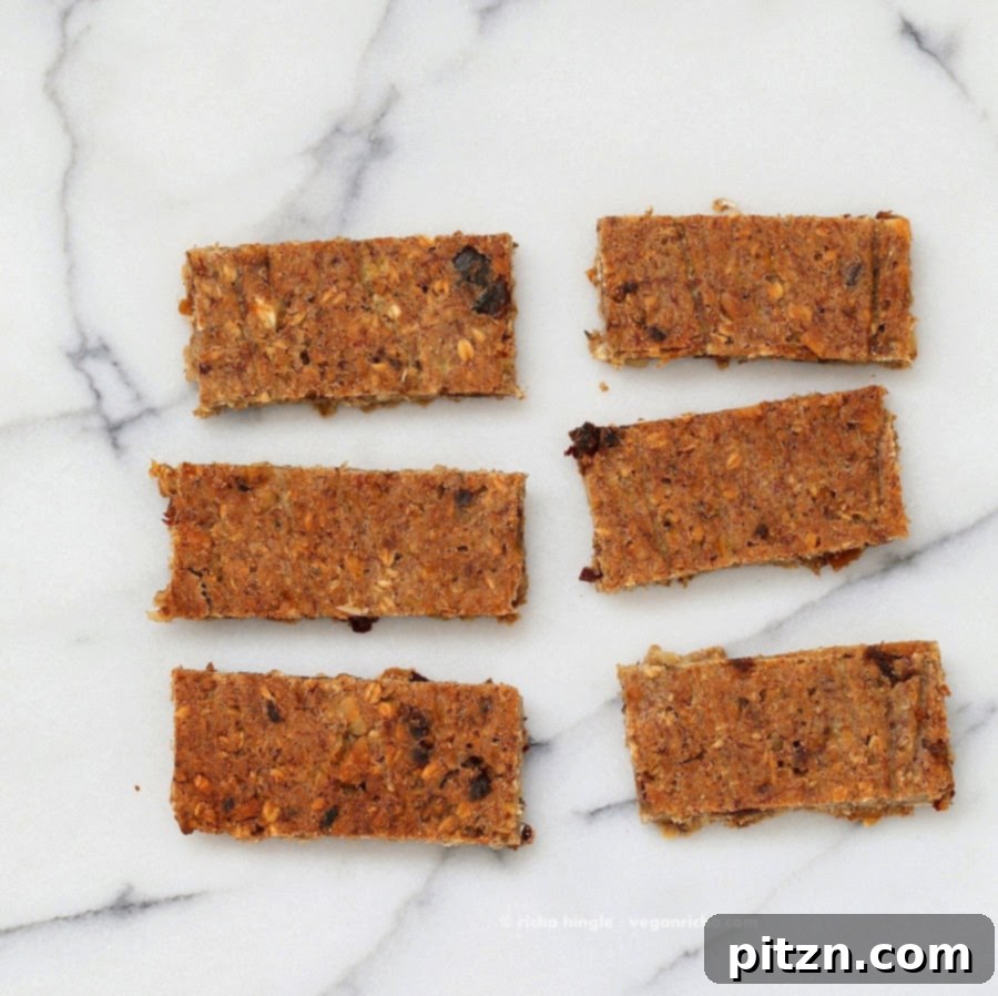 Several banana nut snack bars artfully arranged on a marble surface, emphasizing their homemade freshness.