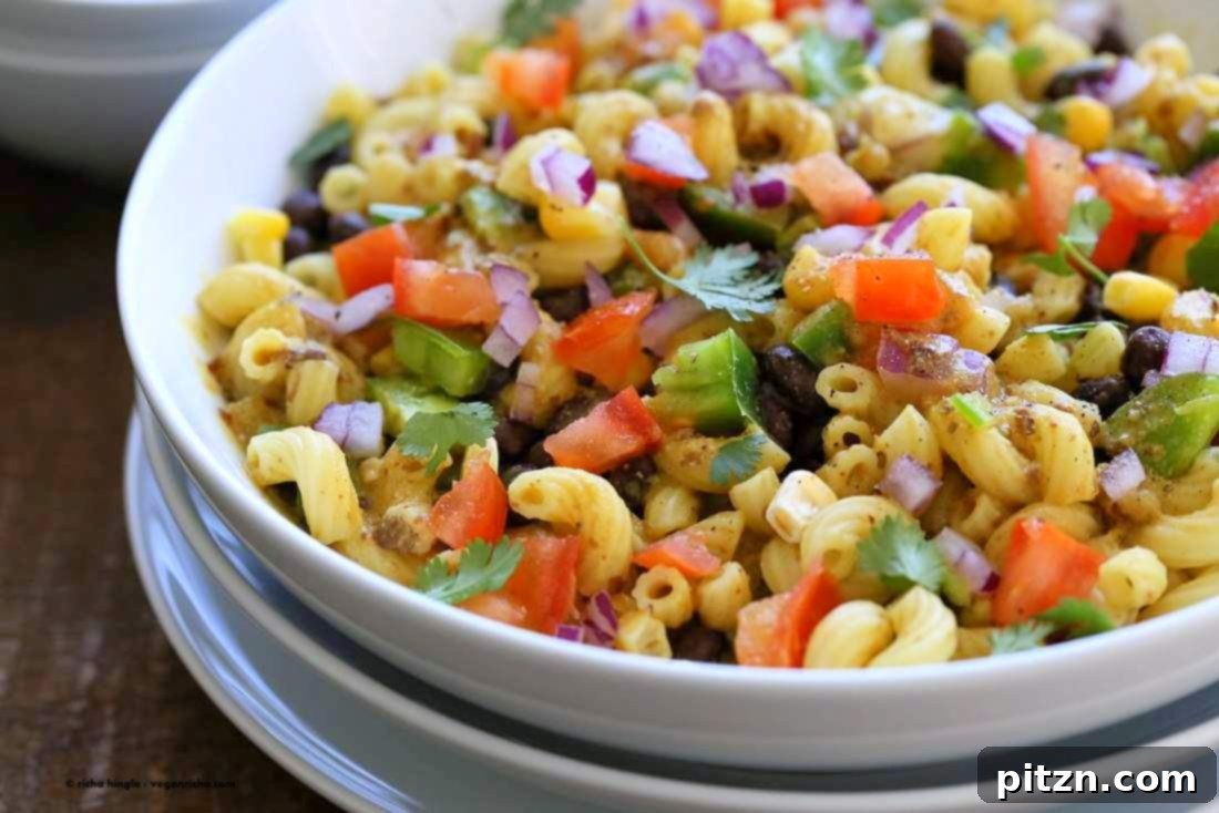 Our vegan Southwestern pasta salad with black bean dressing in a white bowl