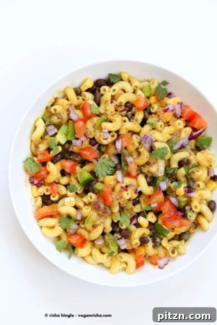 Our vegan Southwestern pasta salad with black bean dressing in a white bowl