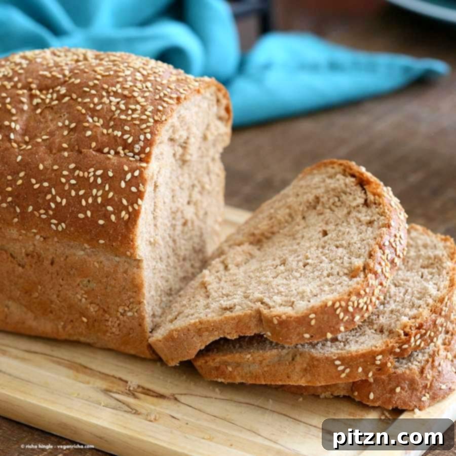 Homemade 100% Whole Wheat Bread 3 Beautifully sliced homemade 100% Whole Wheat Bread revealing its soft and airy vegan crumb