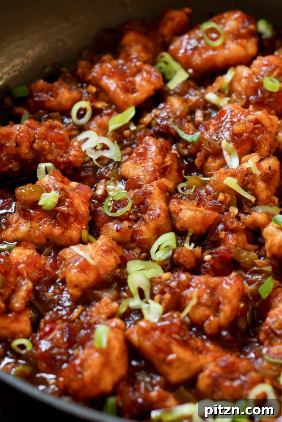 Indochinese Garlic Black Pepper Chicken 3 Close-up shot of Indo-Chinese garlic pepper tofu glistening in the pan