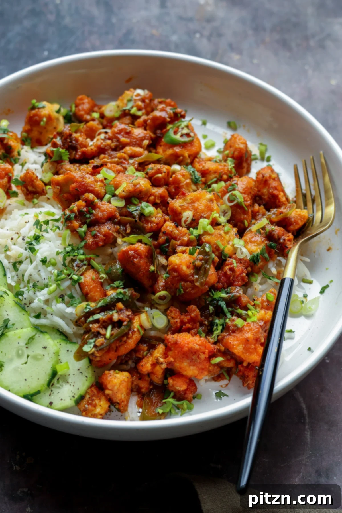 apollo tofu on a plate with rice and cucumber