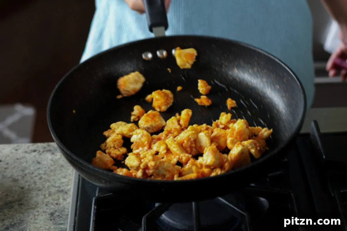 flipping the tofu in the pan