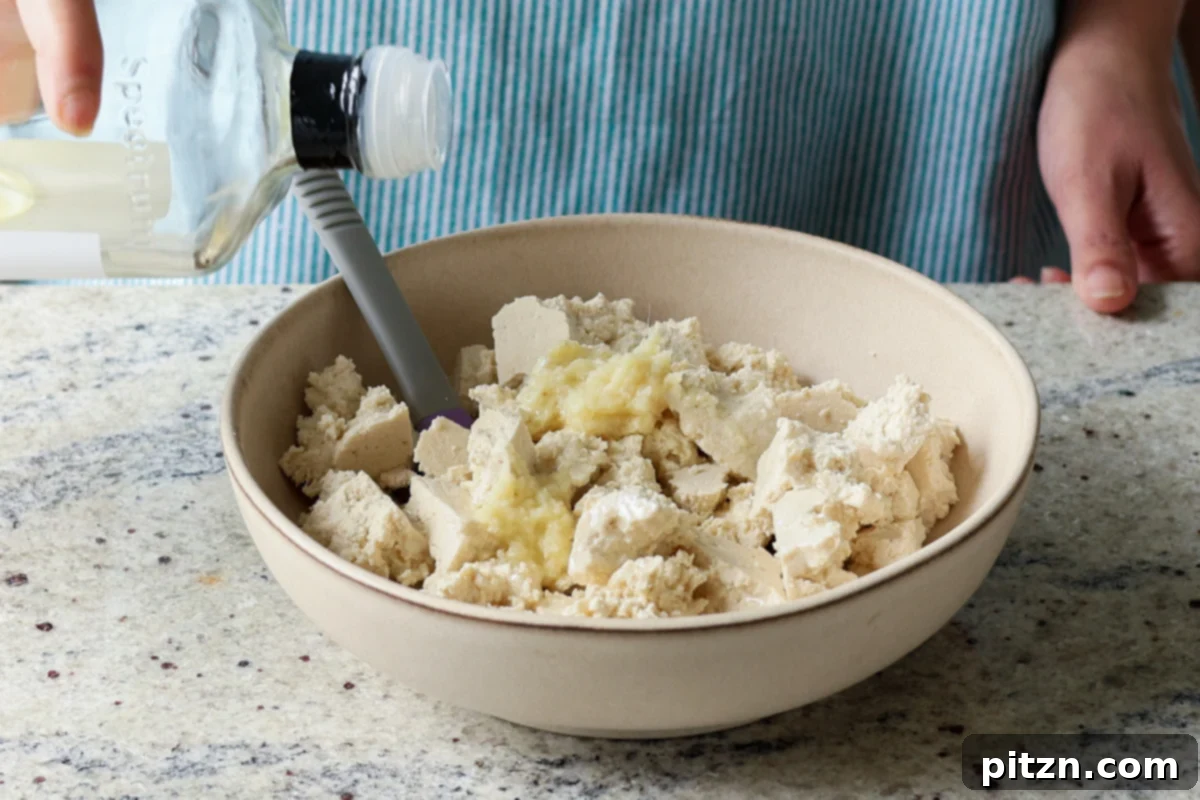 adding oil to the tofu