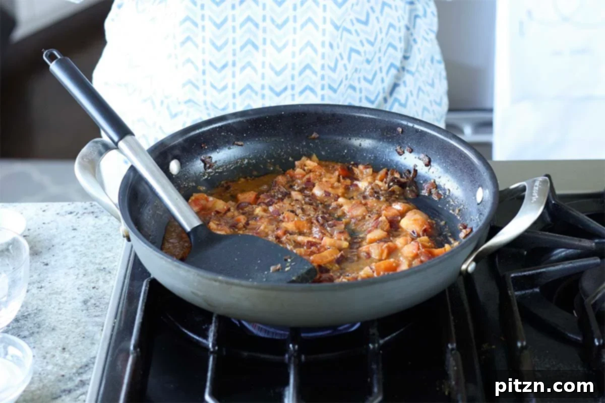Aromatic Sweet Potato and White Bean Curry Stew 13 mashing the tomatoes
