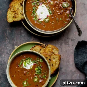 kidney bean chili in bowls with vegan sour cream and other toppings