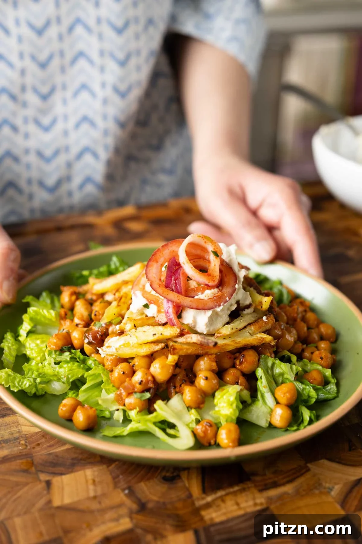 salad made with chili garlic chickpeas and crispy potatoes