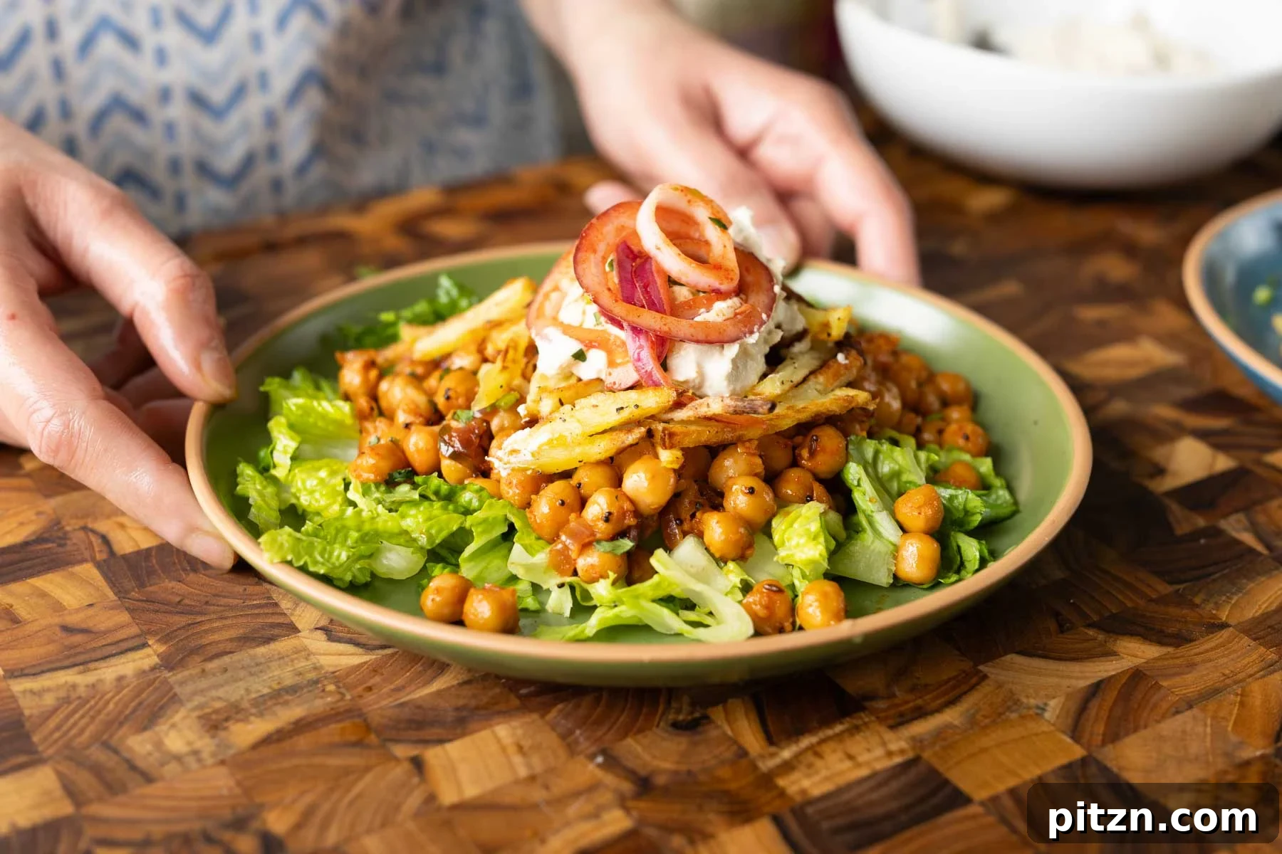 salad made with chili garlic chickpeas and crispy potatoes