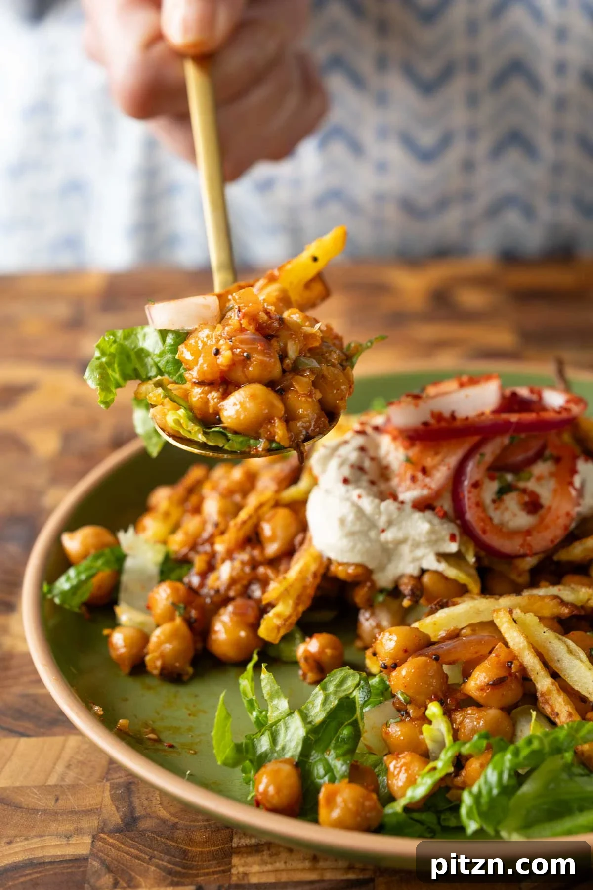 spoon taking a bite of chili garlic chickpeas