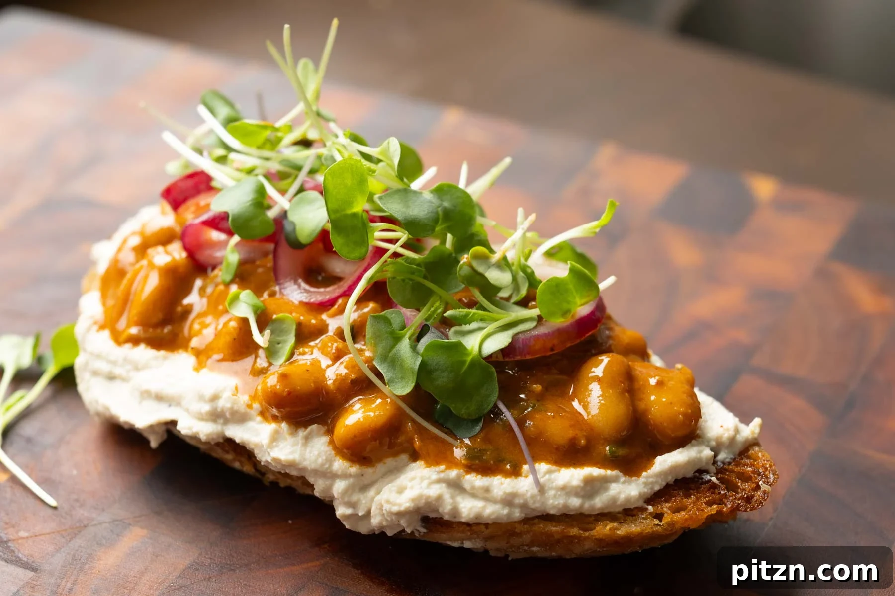 Chili Ginger Garlic Beans with Cumin Whipped Tofu and Onion Salad 7 beans on toast made with the chili garlic beans