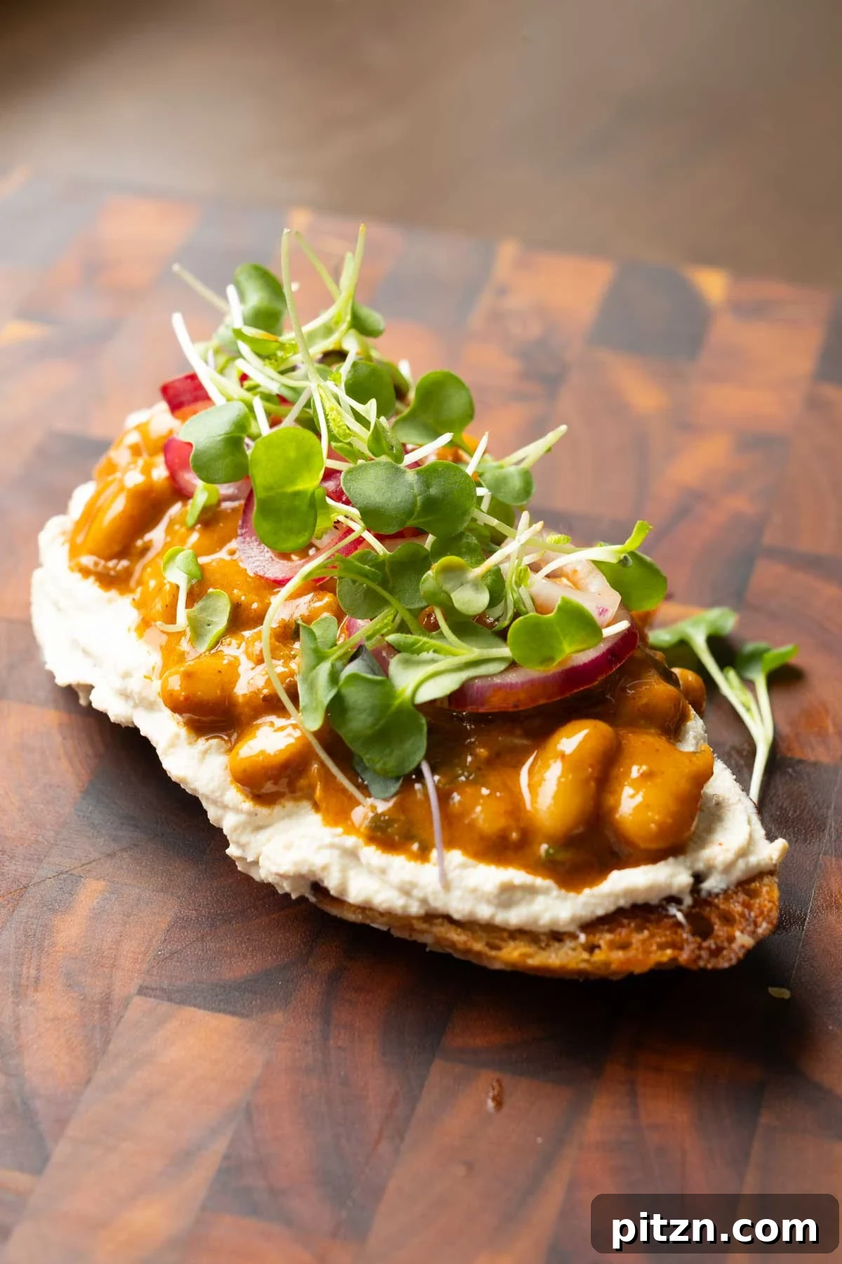 Chili Ginger Garlic Beans with Cumin Whipped Tofu and Onion Salad 4 beans on toast made with the chili garlic beans