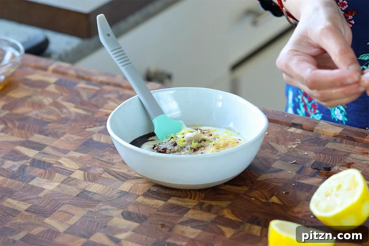adding dressing ingredients to the bowl