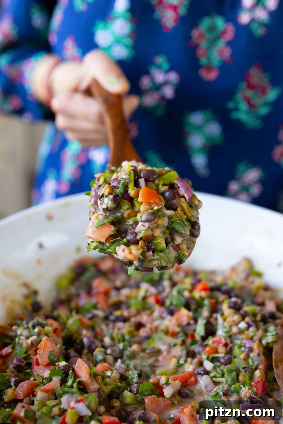 serving spoon of dense bean salad