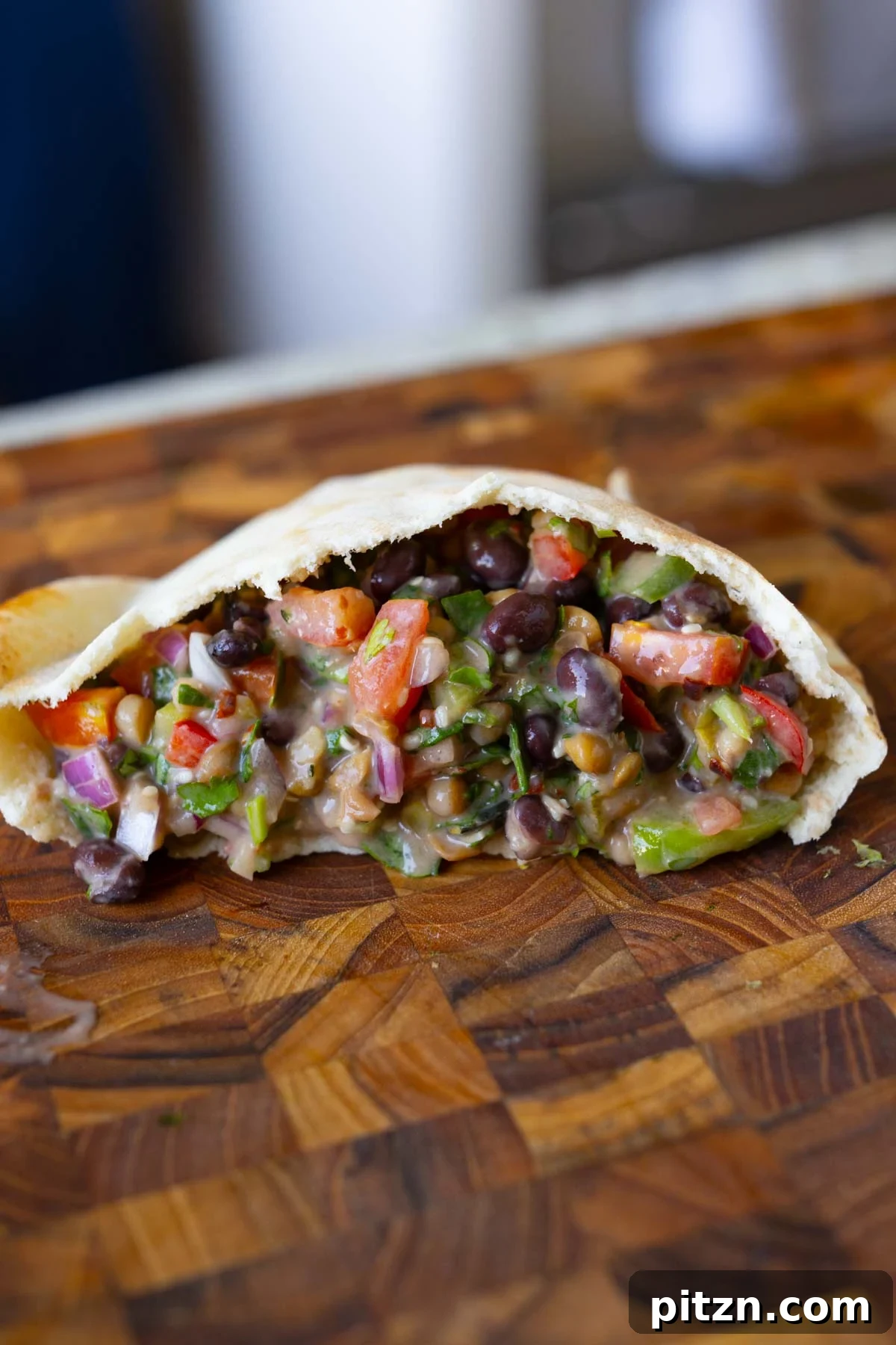 dense bean salad in a pita